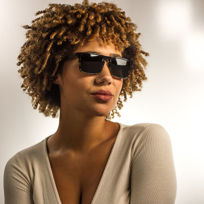 Dana Point polarized lens detail showing UV400 tint and optical clarity, walnut wood frame by Cali Life Co
