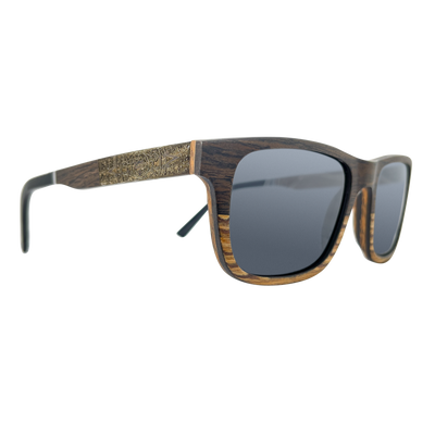 Joshua Tree sunglasses side profile showing real layered walnut and black oak temples and stainless spring hinge, Cali Life Co