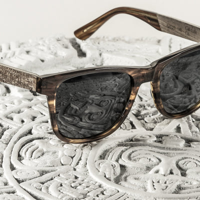 Huntington Beach polarized lens detail showing UV400 tint and optical clarity, walnut wood frame by Cali Life Co