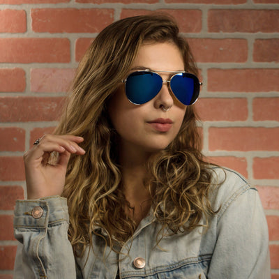 Pacific Beach polarized lens detail showing UV400 tint and optical clarity, walnut wood frame by Cali Life Co